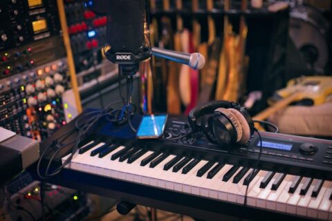 Studio keyboard, microphone, headphones, and audio equipment